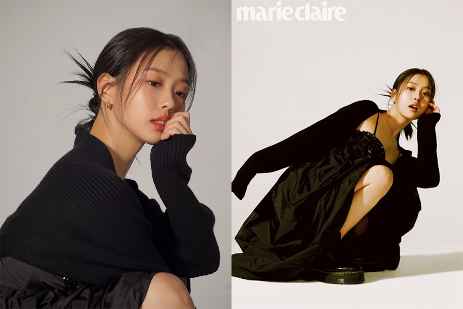 穿著黑色套裝的女性拍攝於室內，背景為簡約白色空間