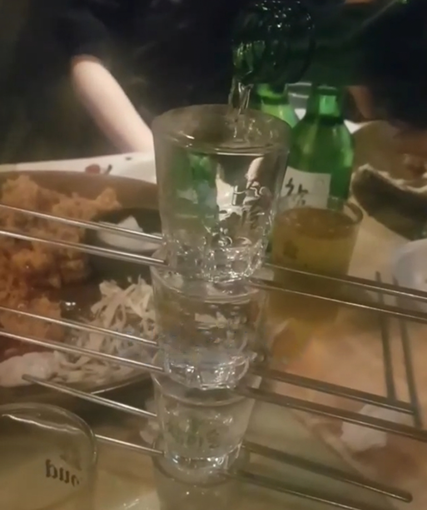 Birthday drink tower made of soju glasses and chopstick - a birthday celebration in korea