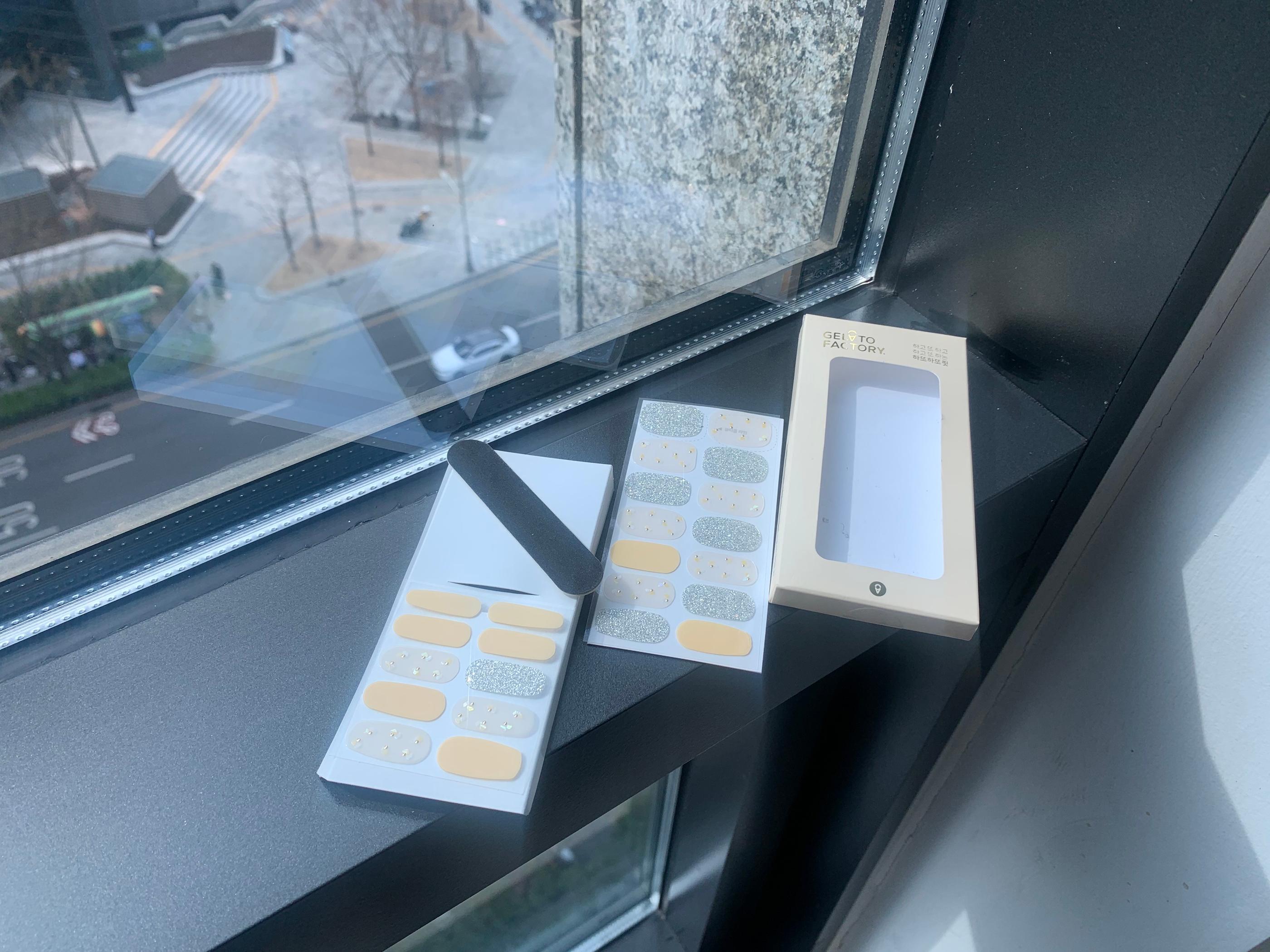 contents of gelato factory nail sticker laid out on window sill