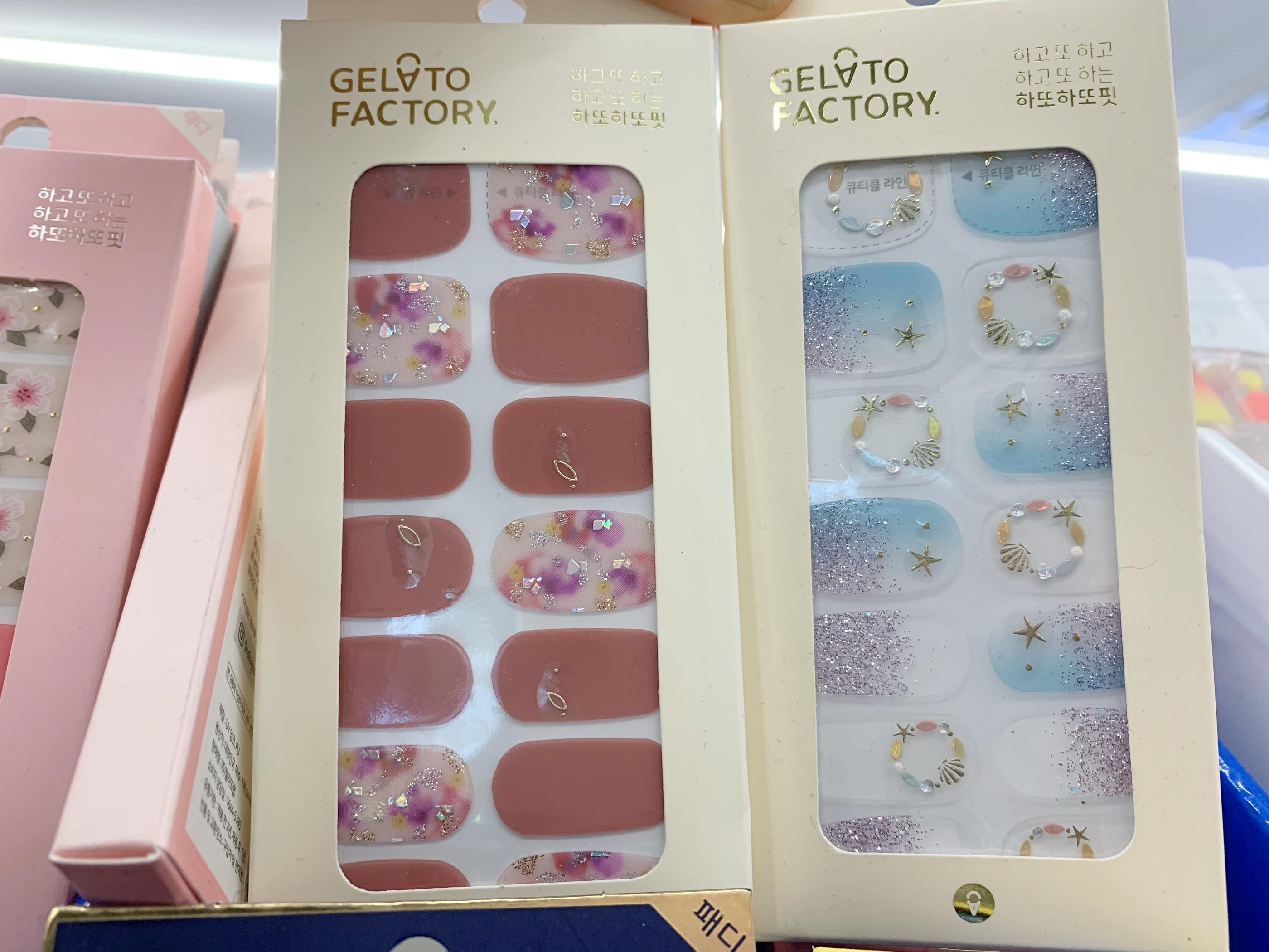 gelato factory nail stickers at olive young, one in pink with embossed jewels, another in blue with jewels and seashells