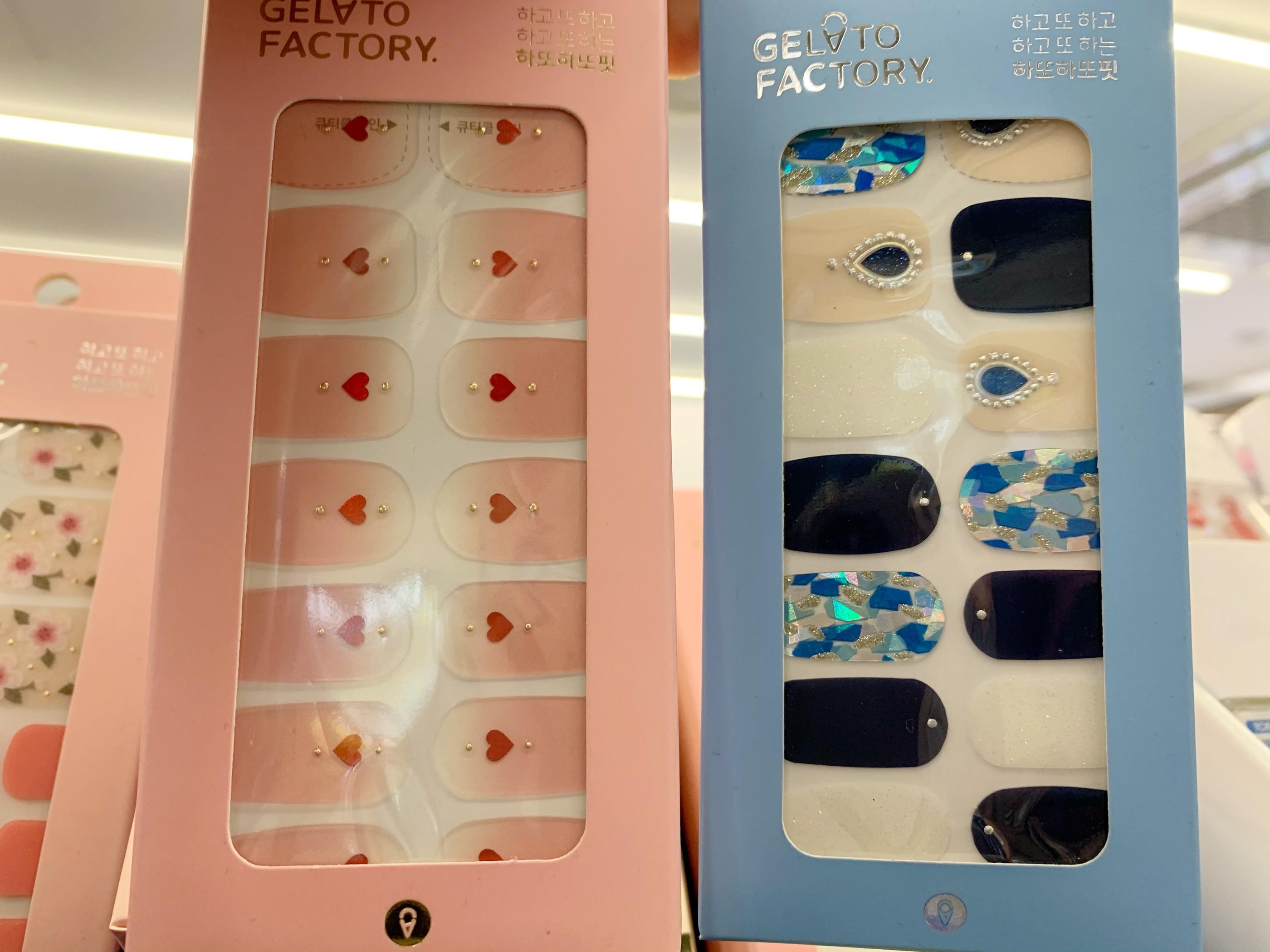 gelato factory nail stickers, one with pink gradient and small hears, another blue and black with block patterns at olive young