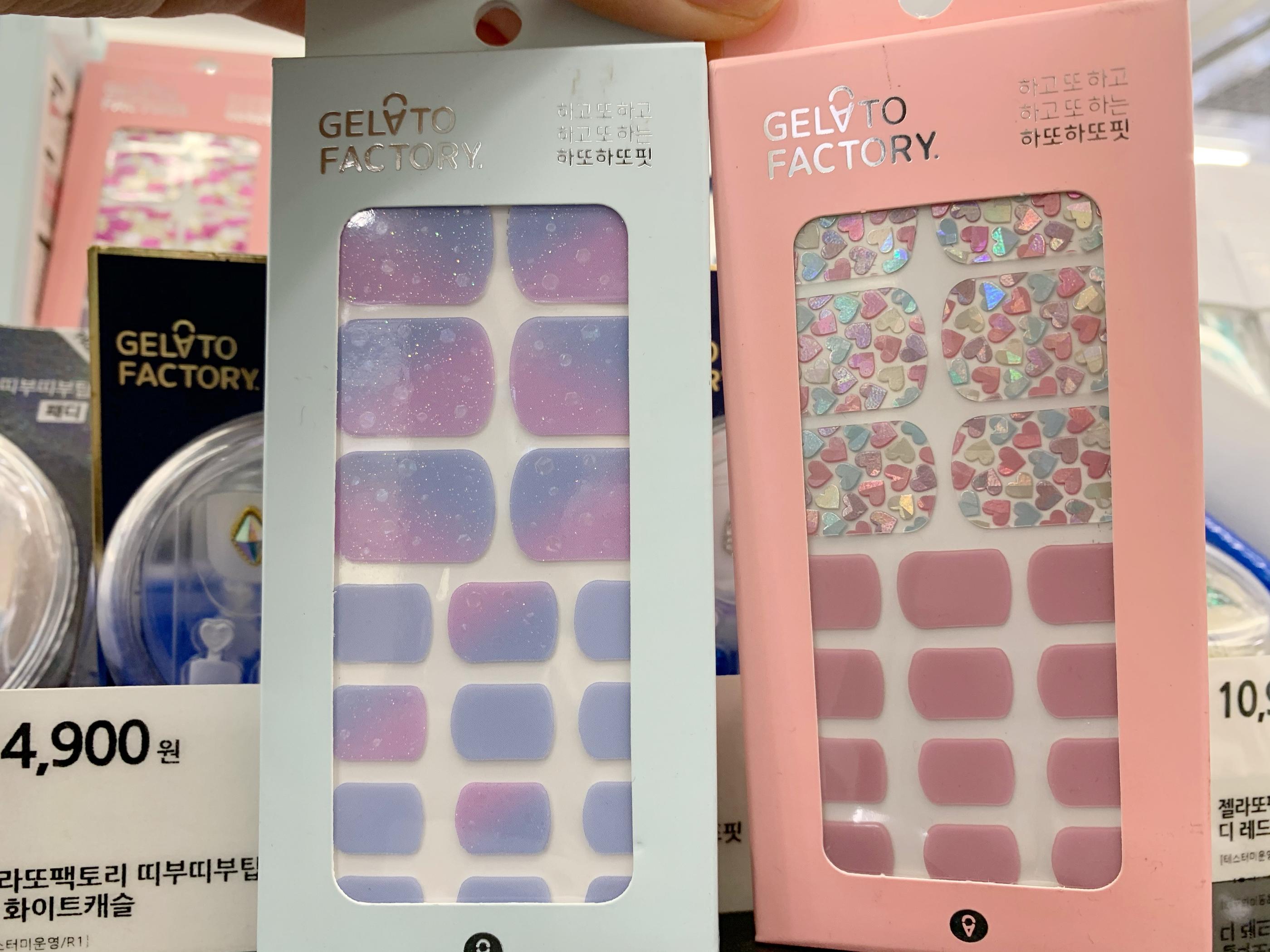 gelato factory nail stickers at olive young, one with purple/pink color gradient, another in pink with various colored hearts.