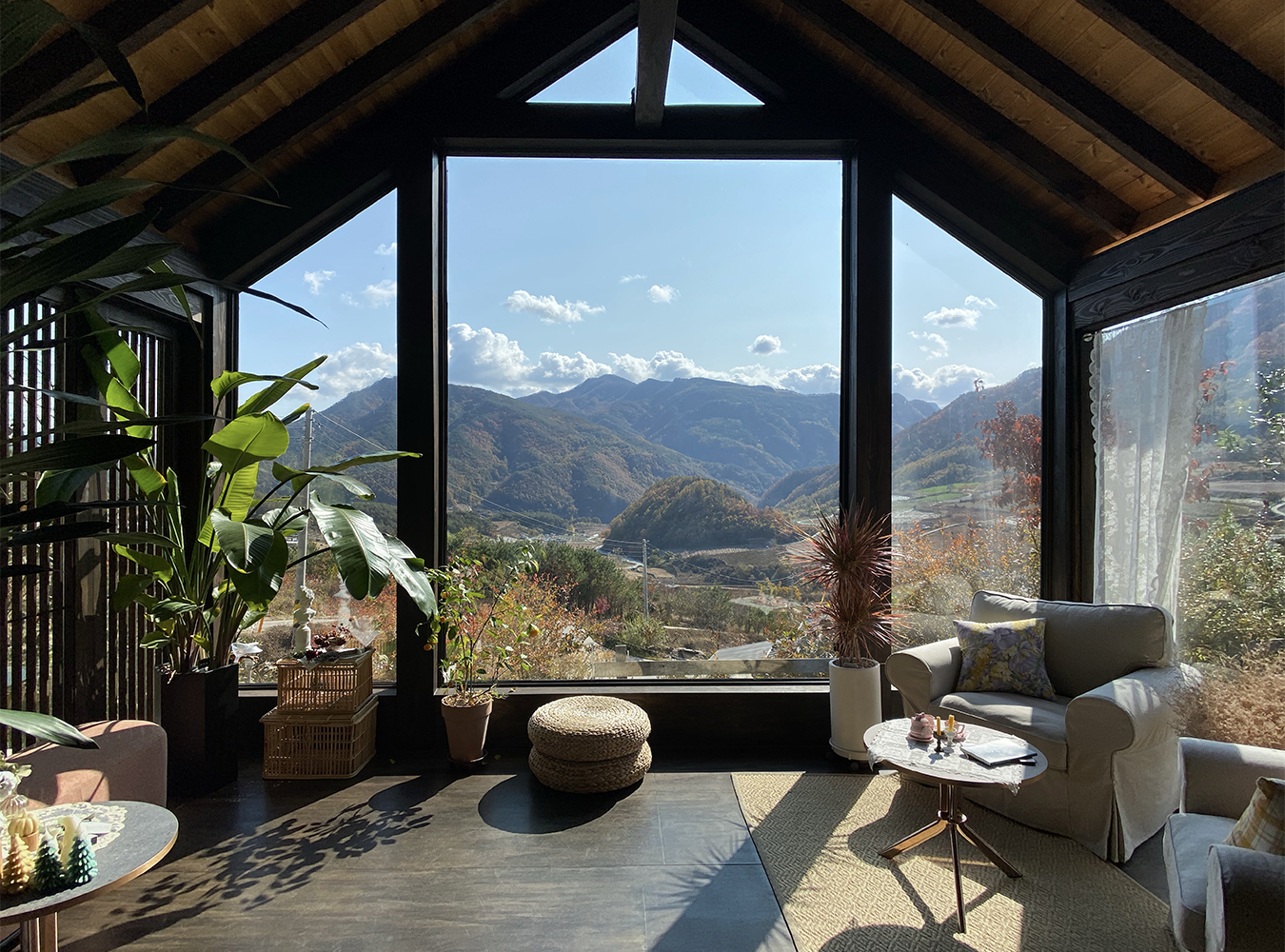 Holly Garden in Andong with a breathtaking view of the mountains and clouds through its floor-to-ceiling windows
