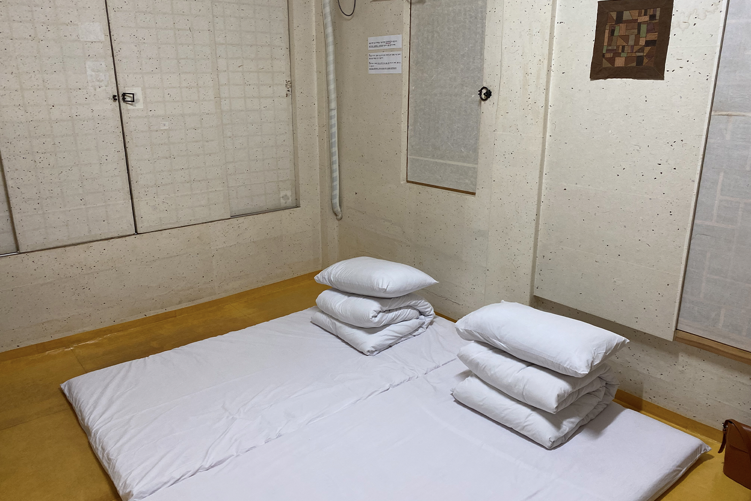 Traditional Korean sleep set-up of a mat, duvet and a pillow at Jirye Arts Village