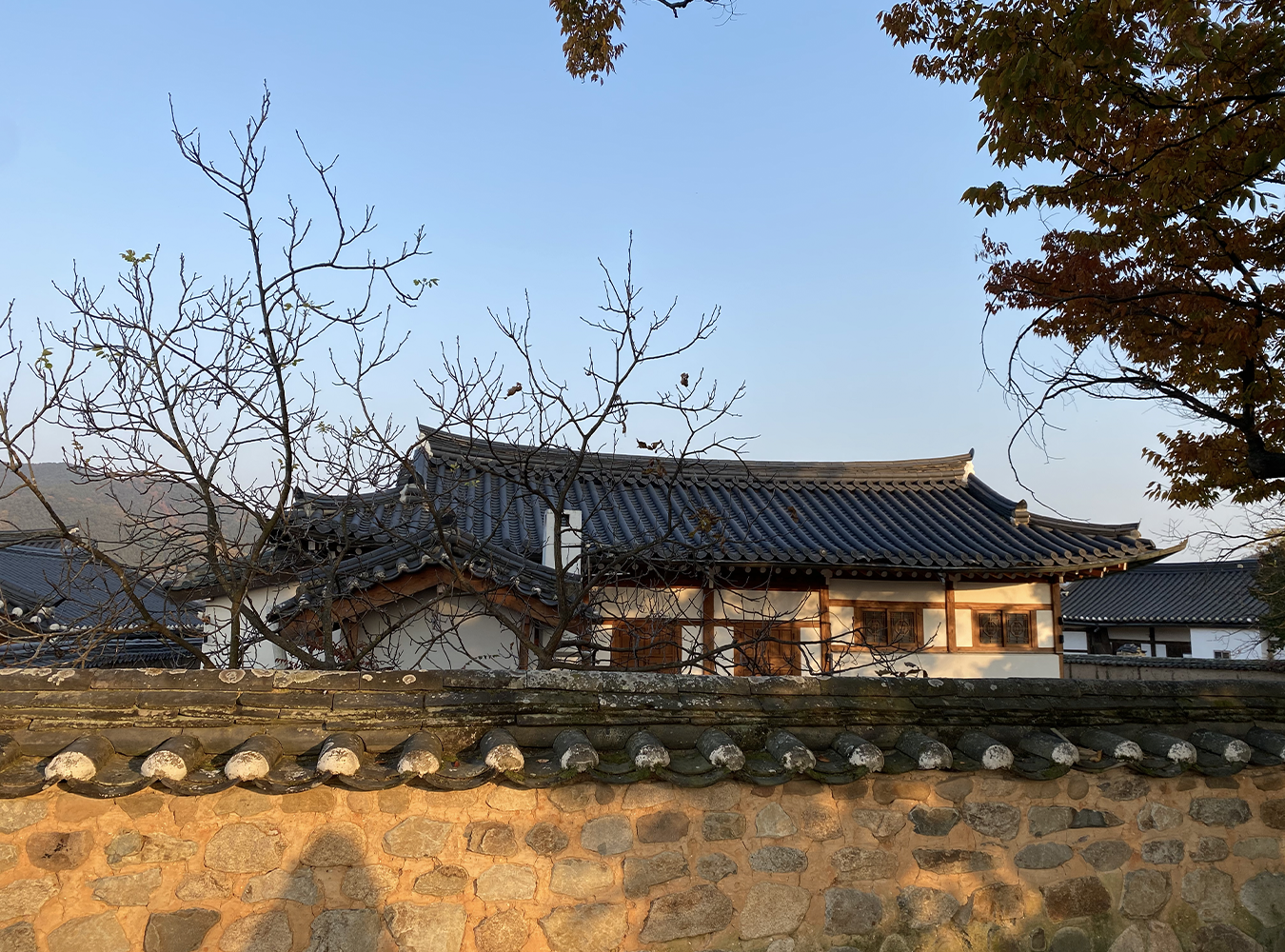 andong hahoe village - a traditional building behind stone walls