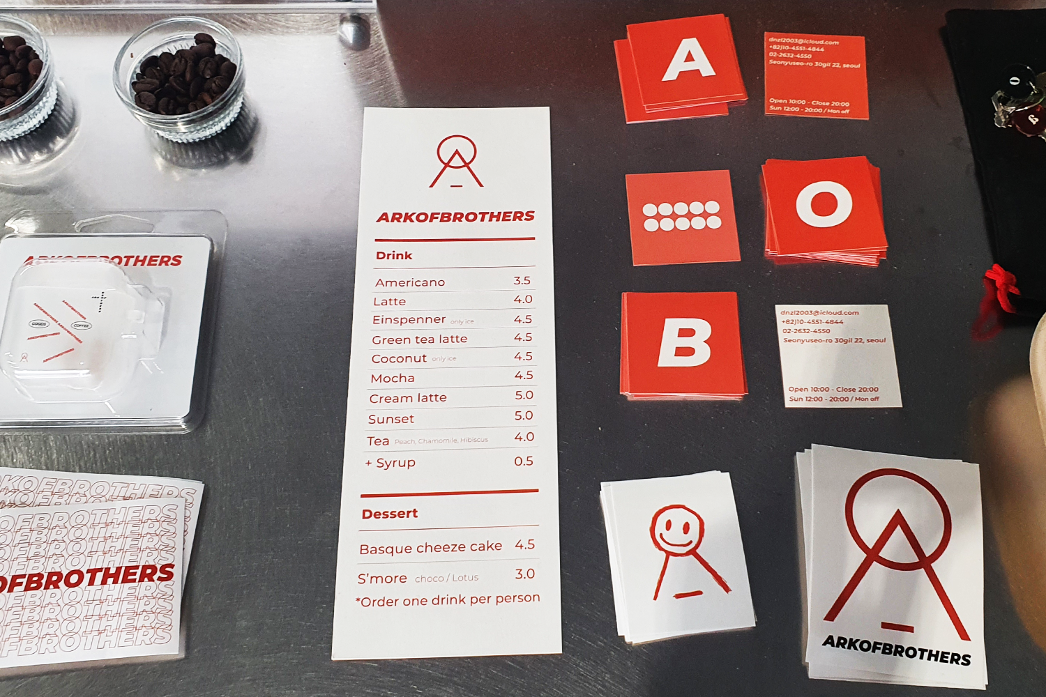 ark of brothers menu and stickers on table