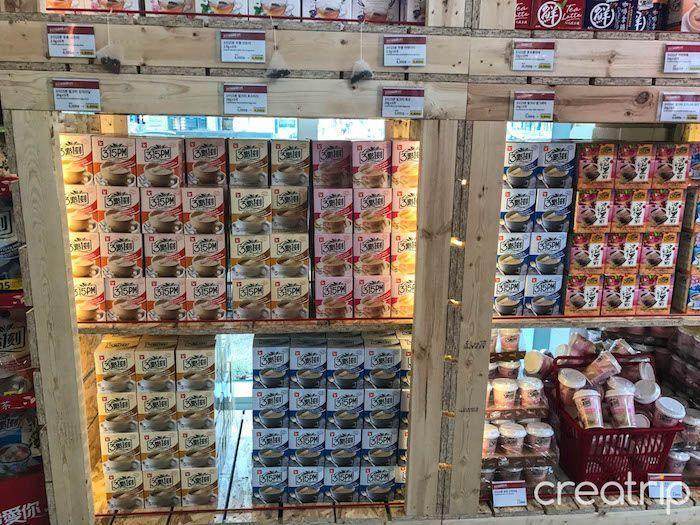 Shelves filled with various flavors of 3點一刻 milk tea at TAIWAN CAFE in Seoul's Gangnam area.