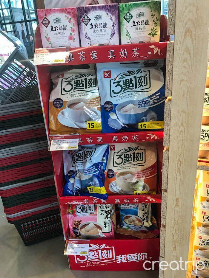 Close-up of large packs of 3點一刻 milk tea displayed at TAIWAN CAFE in Gangnam, Seoul.