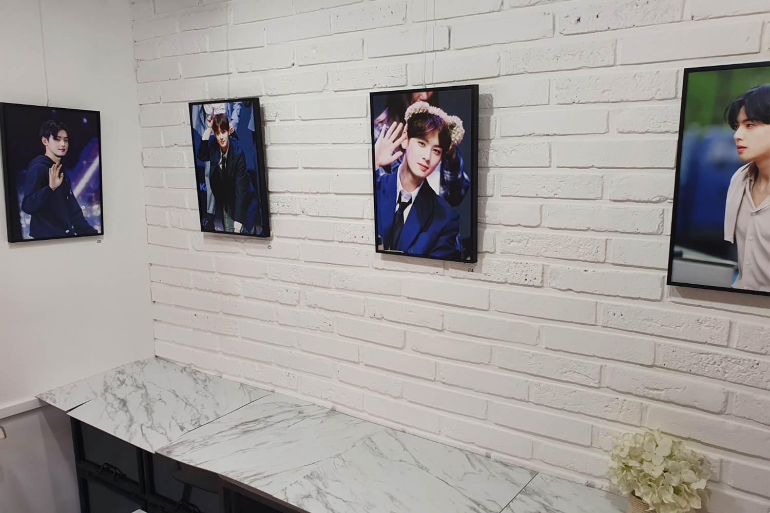 cha eun-woo photos framed on wall