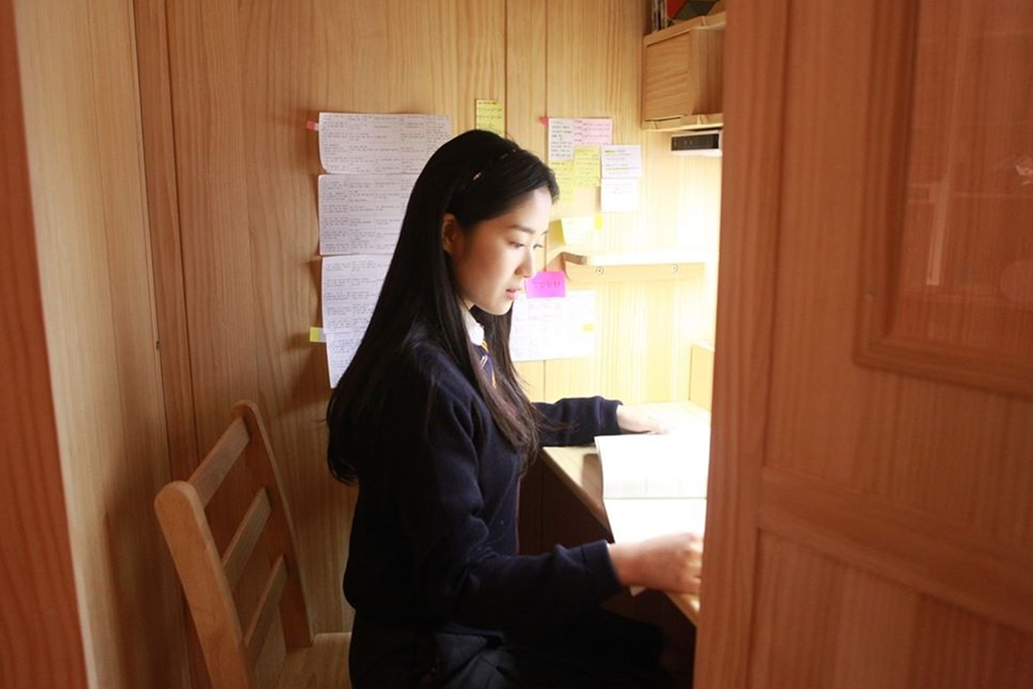 sky castle scene student studying at her desk in her room