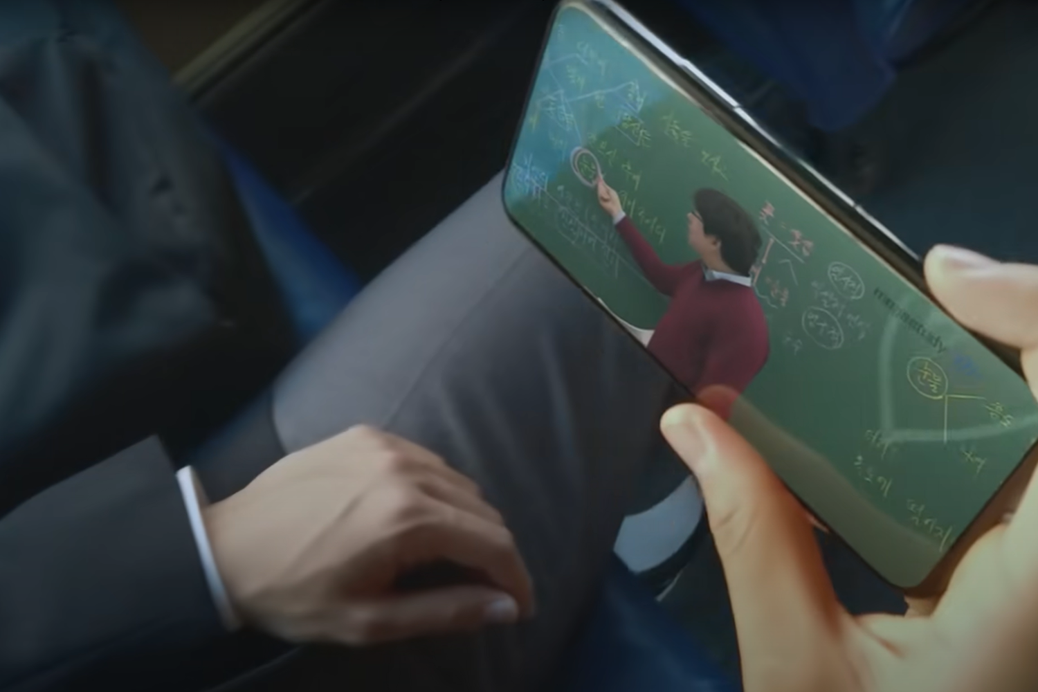 student watching lecture on his phone