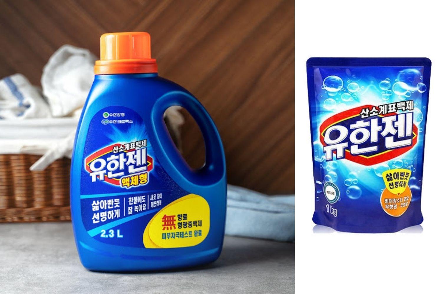 Chất tẩy quần áo Hàn Quốc Yuhanjen dạng lỏng với chai màu xanh dương và nắp màu cam, nổi bật cho khả năng tẩy trắng hiệu quả.