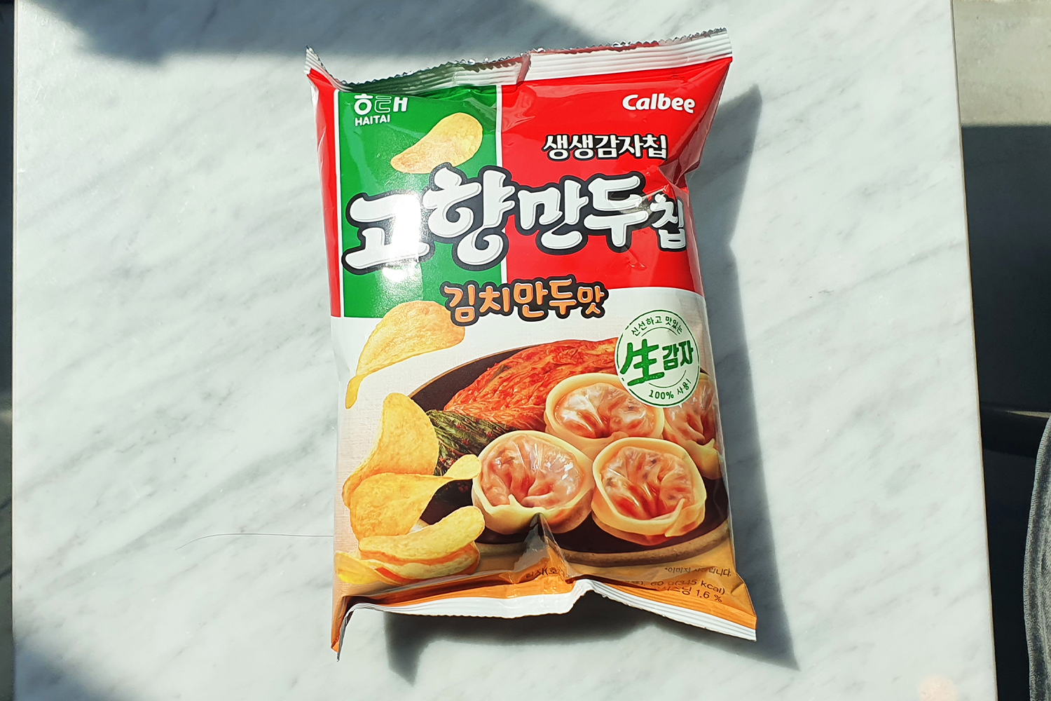Korean dumpling potato chips at CU on a white table