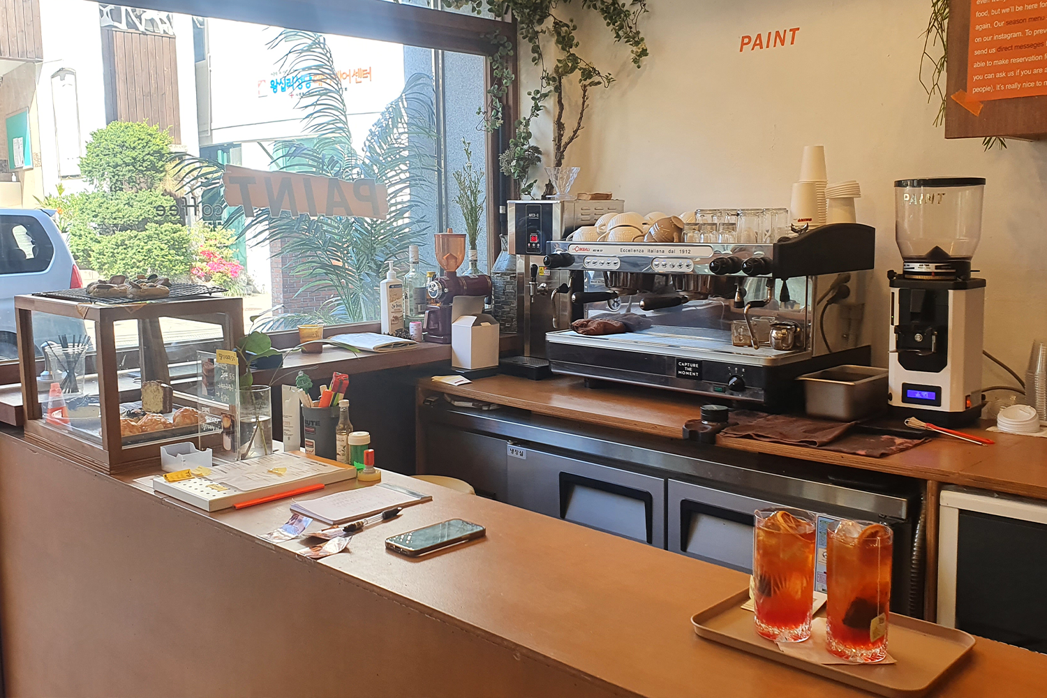 paint menu counter with two drinks