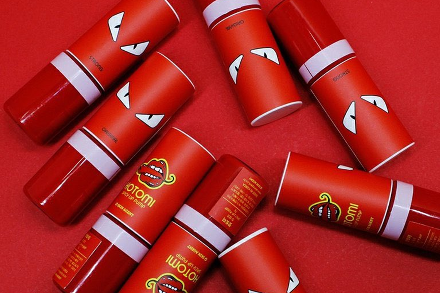 핫토미的辛辣唇釉產品，包裝設計以紅色為主並印有生動插畫。