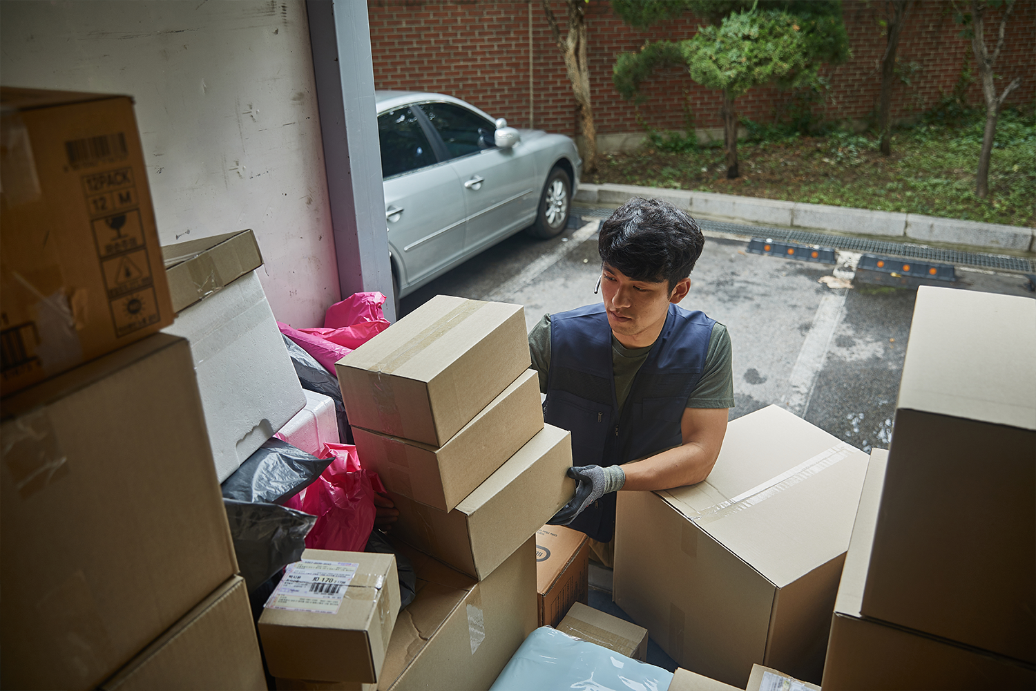 delivery man sorting package
