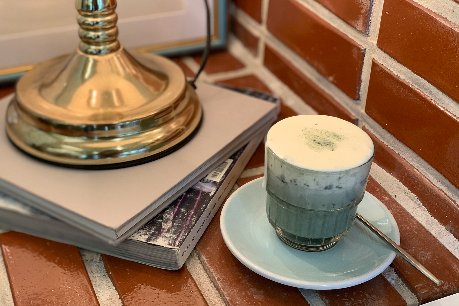 sweet cream mugwort latte on table at Cafe Birkin