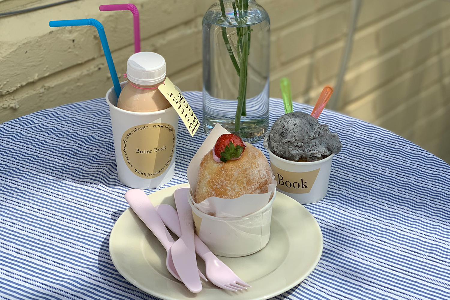 butter book cafe outdoor seating drinks and desserts on a plate on a table