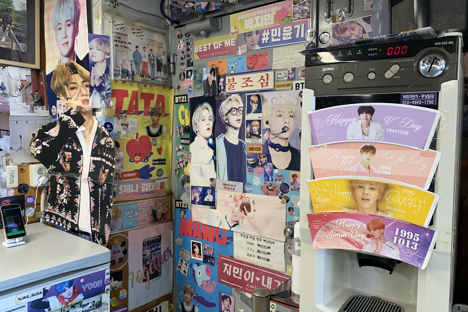 cardboard cutout V infront of BTS wall at Yoojung Sikdang