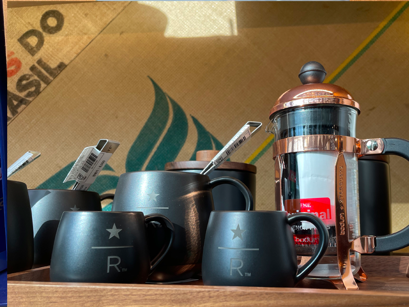 starbucks reserve coffee set up with mugs, french press, and wooden tray