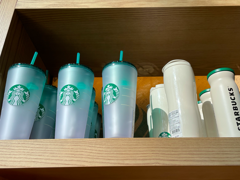 starbucks tumblers on shelf at starbucks korea