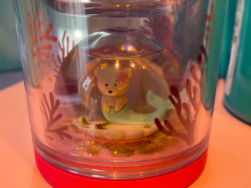 closeup of bear-mermaid figure in under sea water ball tumbler from starbucks korea