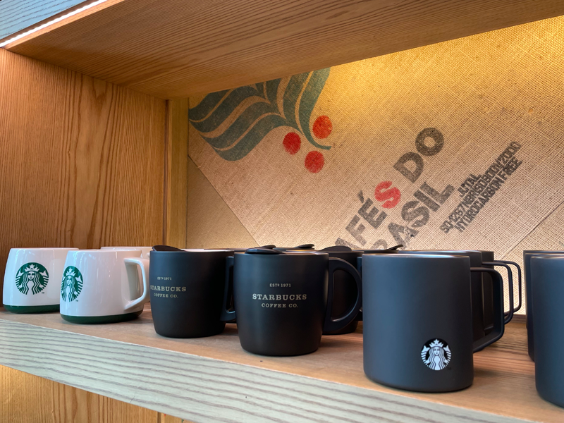 starbucks mugs on shelf