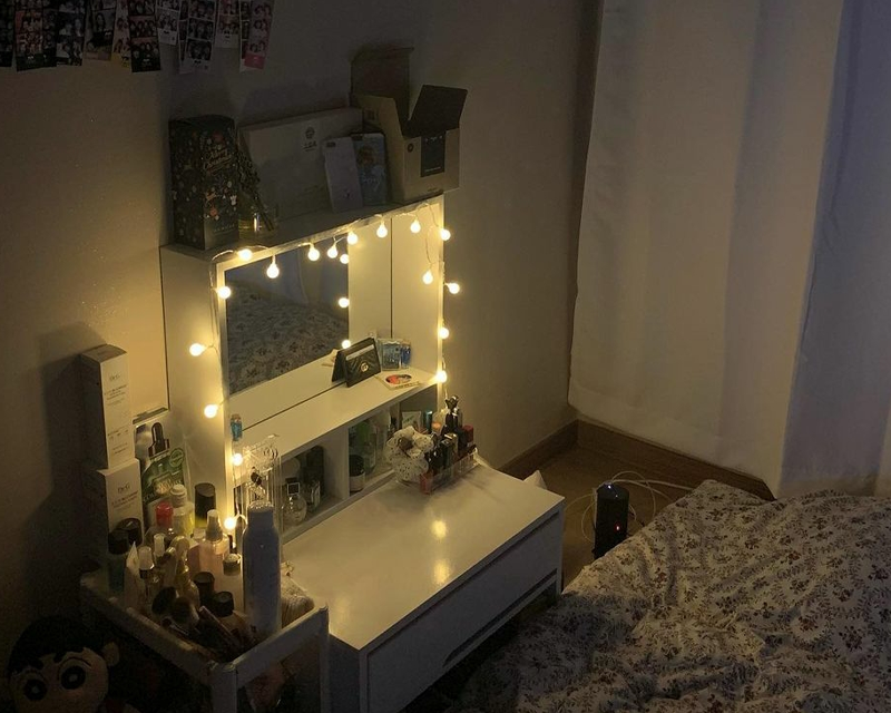 white low vanity table next to bed