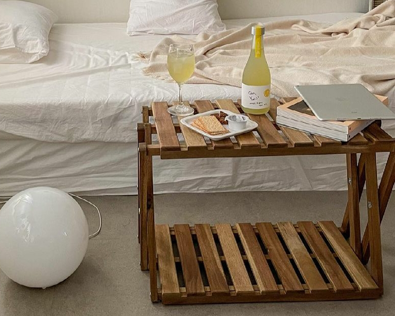 drinks and biscuits on top of wooden low side table