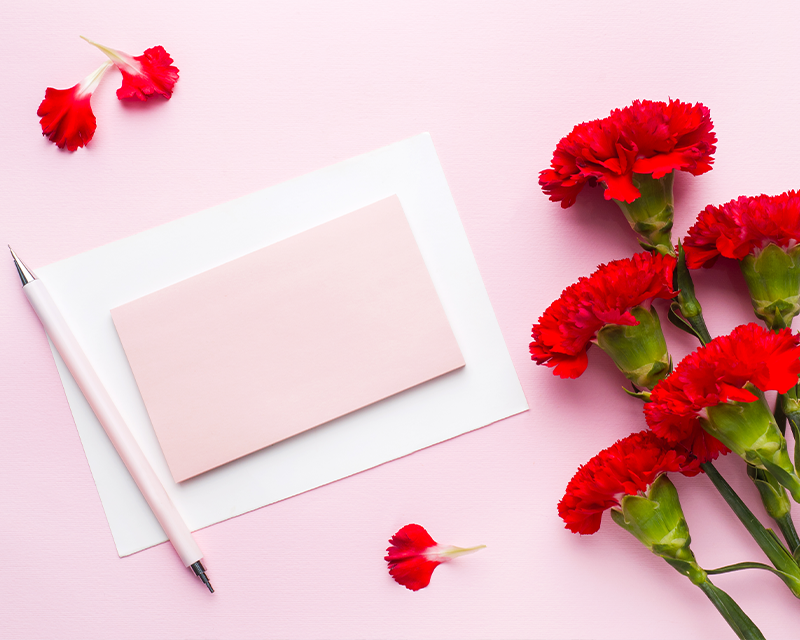 Handwritten letter and carnation for Parents