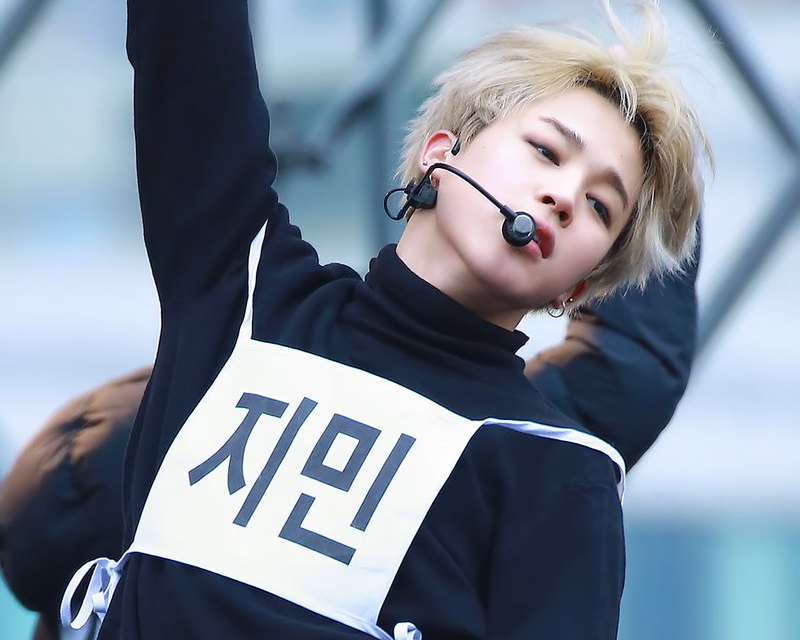 BTS Jimin wearing name tag on a black shirt