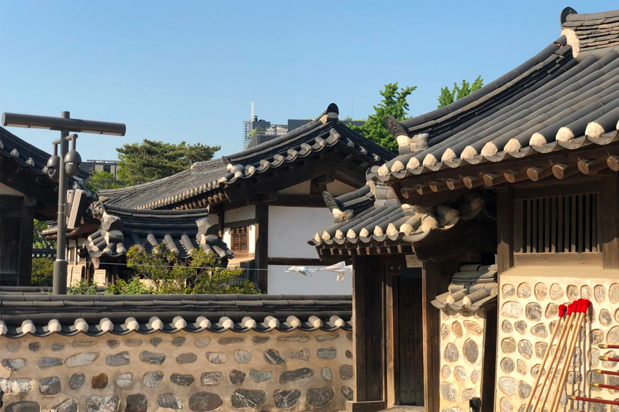 Rooftops of traditional Korean houses illustrating symmetry and beauty at Namsan Hanok Village, Seoul.