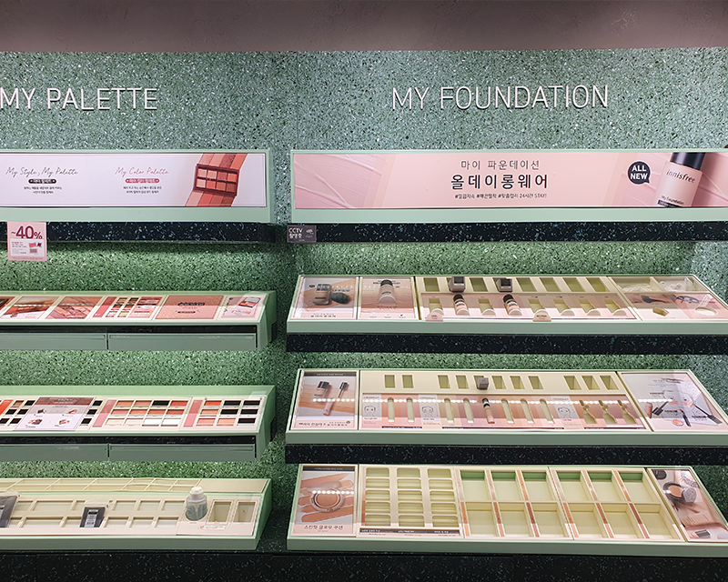 Innisfree green cycle store cosmetics displayed green wall