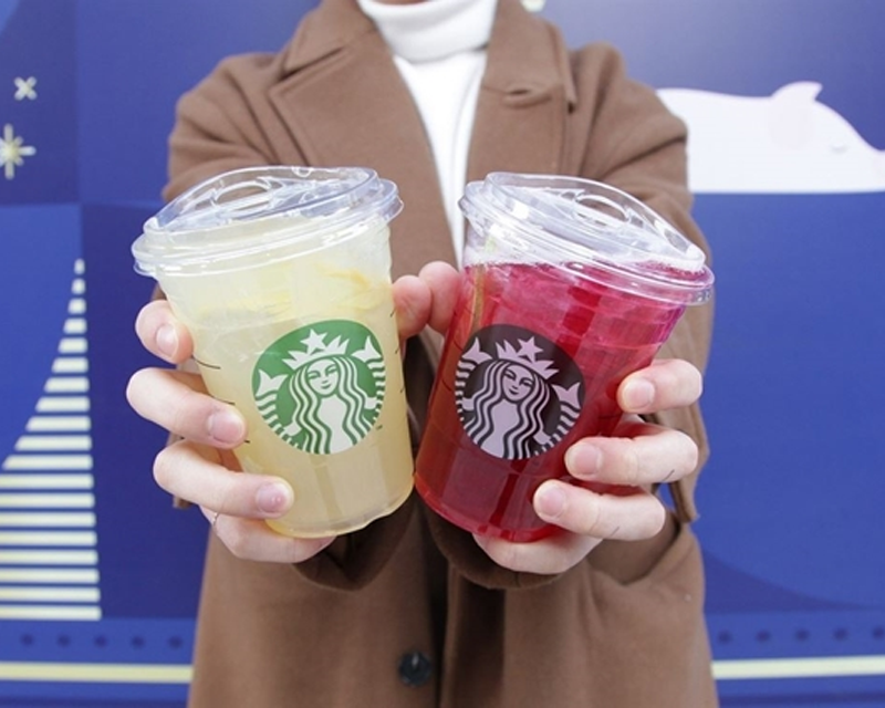 two Starbucks cups without straw