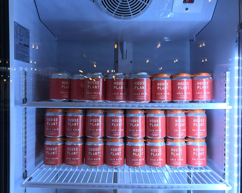 Cold Brew House Plant red cans in the fridge