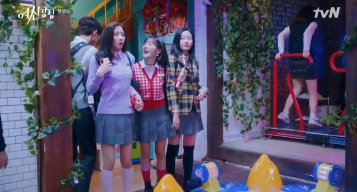 Three school girl characters in True Beauty heading to an arcade hall