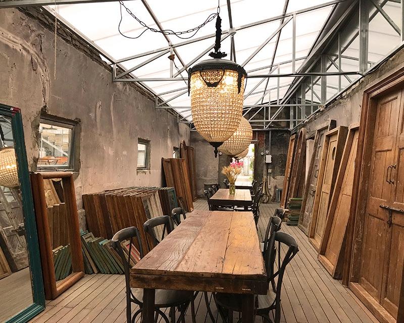 chandelier above the wooden furniture Hanam House Plant
