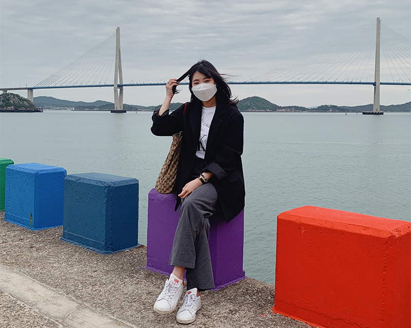 Girl sitting on purple seat at Mokpo sea