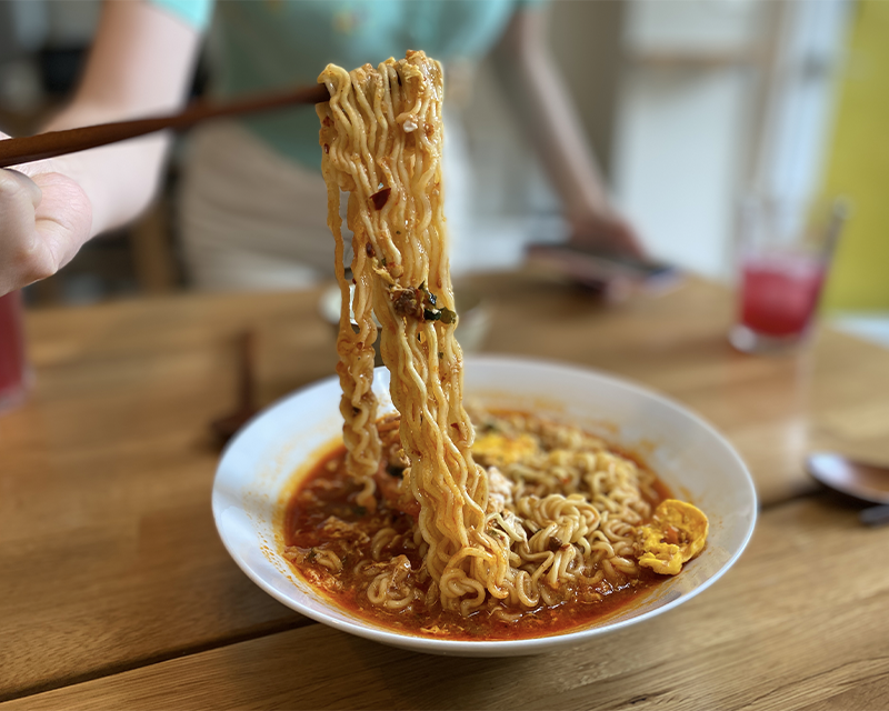 Taking a huge chopstick full of NCT Chenle