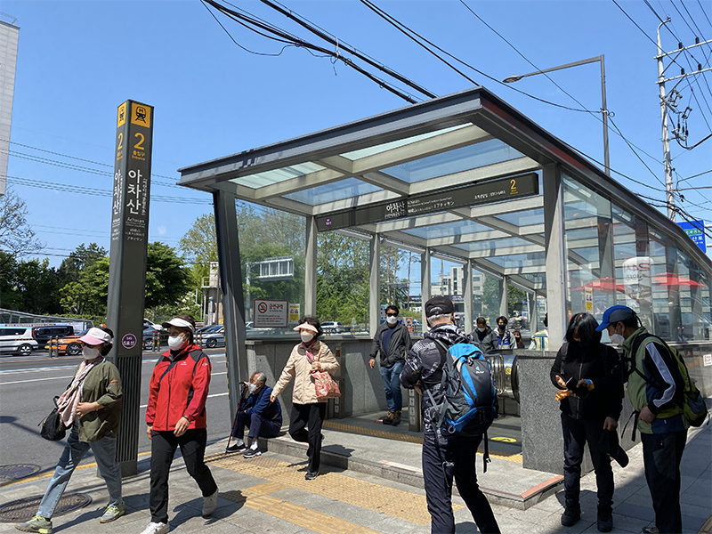 Achasan Station exit 2, Seoul, Korea with hikers walking out of the exit