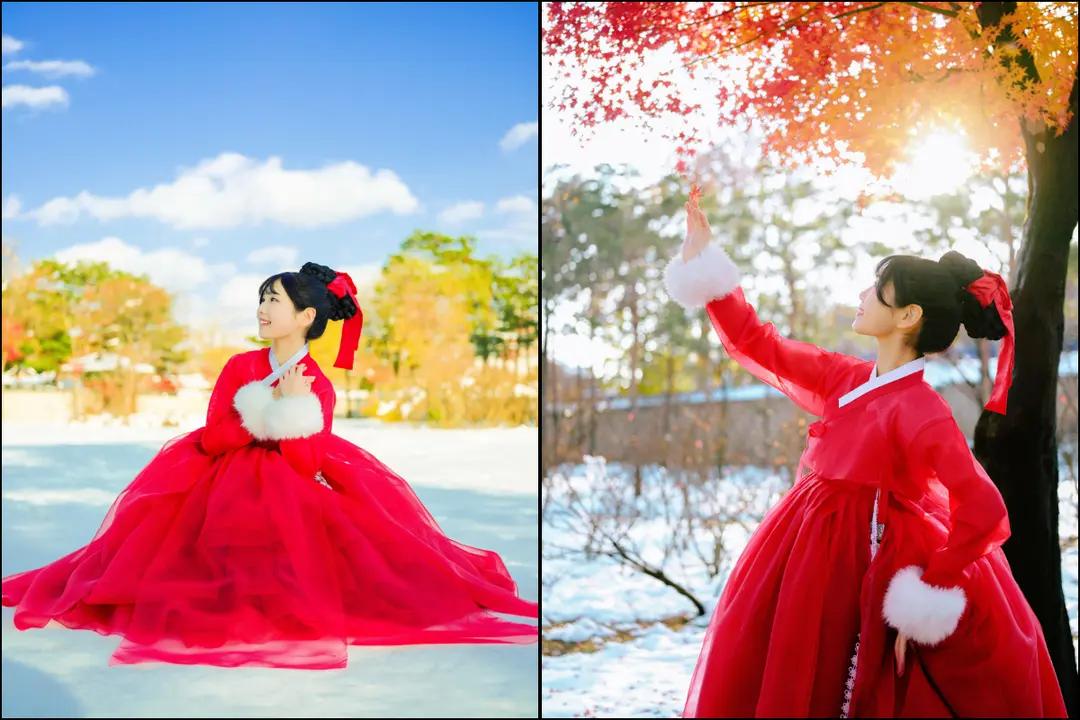 身穿鮮紅色韓服、佩戴髮飾的女性在雪地與秋色交錯的景福宮周邊拍照，展現冬季古宮穿韓服的浪漫體驗與拍照氛圍。