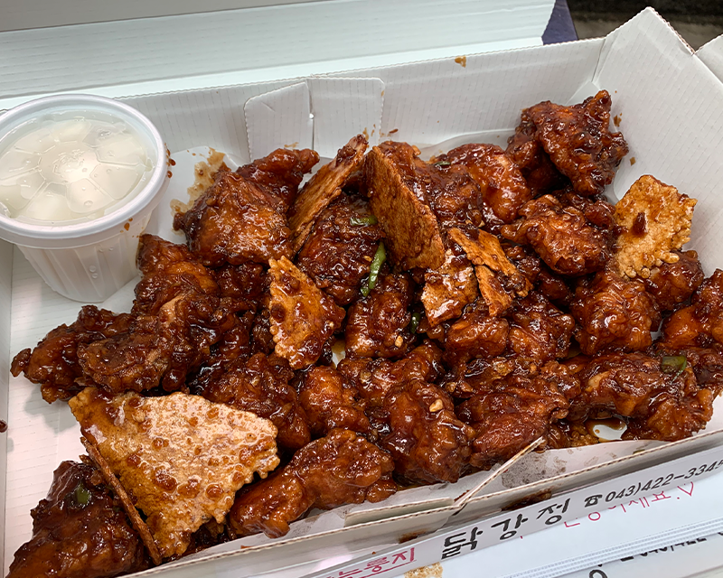 Black Garlic Scorched Rice Sweet & Sour Chicken in box from gugyeong market in danyang south korea