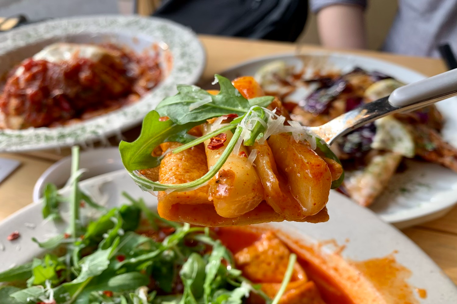 spoonful of arugula tteokbokki at Pyun Meal Mill Daegu