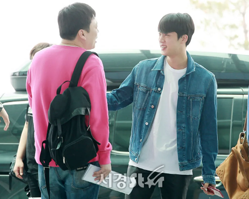 BTS Jin with his manager infront of a black car