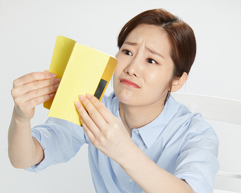 Girl stressed holding up her bank account