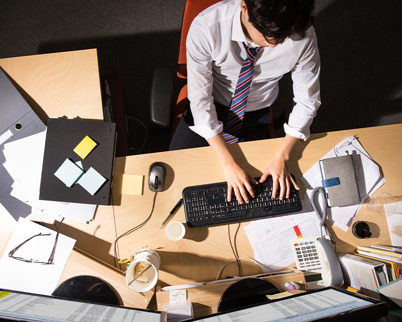 men working behind desk in Korea at night