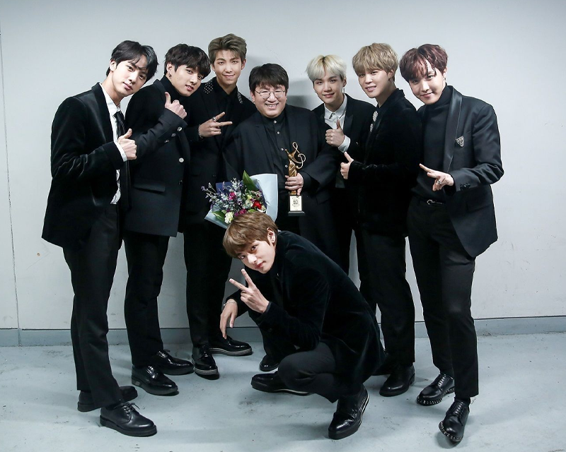 BTS wearing tuxedos with HYBE founder