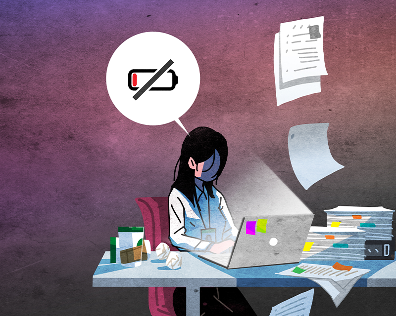 Animated image of girl working behind desk with laptop with low battery