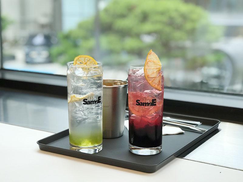 Cherry ade and Green grape ade on a black tray at YG the SameE cafe