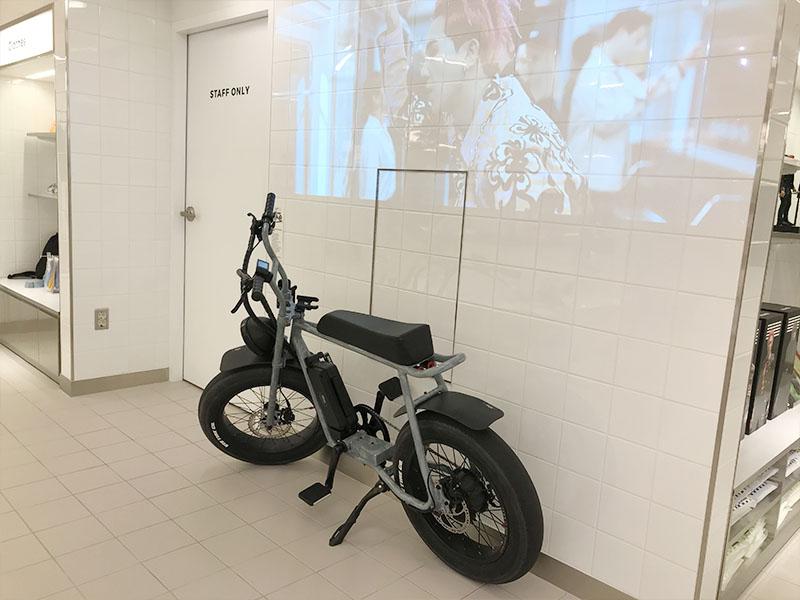 black motorbike infront of white wall at YG the SameE cafe